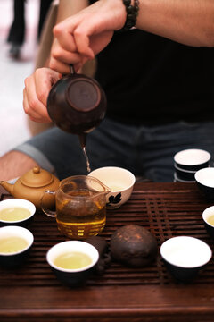 master at the tea ceremony pours tea close-up