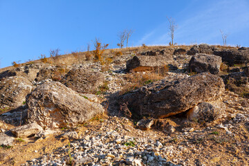 Rocks on the hill . Landslide with rockfall 