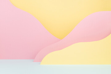 Abstract colorful empty stage mockup - paper landscape with mountains pink, yellow, mint color  in baby cartoon naive style. Art background for presentation of cosmetic produce, gift, goods.