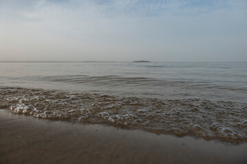 Sand beach, evening lake. Defocus