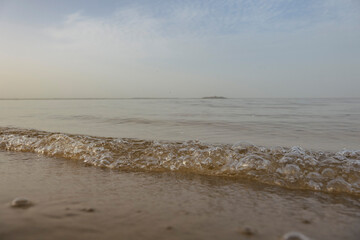Sand beach, evening lake. Defocus