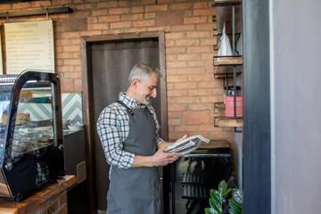 Cafe owner performing product quality control in his establishment