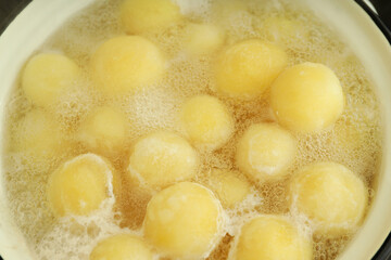Concept of cooking with boiled young potatoes