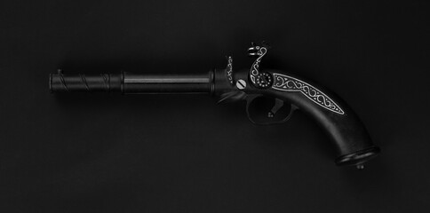 pirate pistol isolated on black background