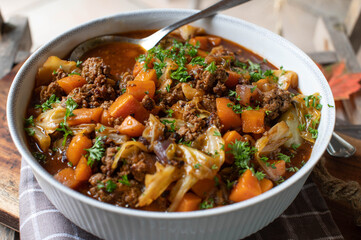 Ground beef stew with vegetables and cabbage