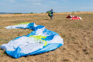 Paraglider pilot picked up after landing on the ground