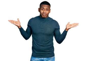 Young black man wearing casual sweater clueless and confused with open arms, no idea and doubtful face.