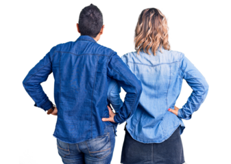 Couple of women wearing casual clothes standing backwards looking away with arms on body