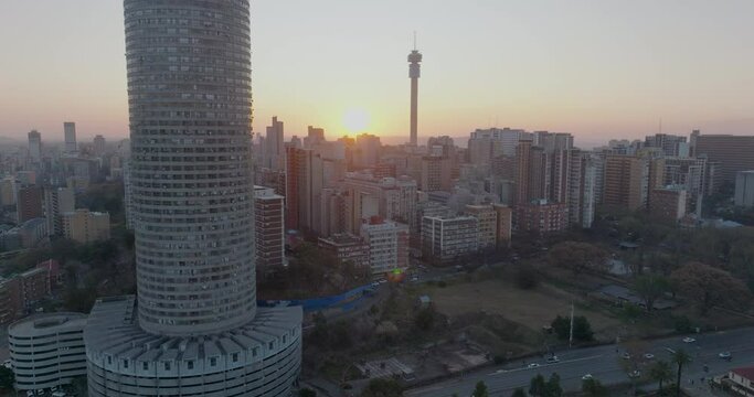 Aerial view of the magnificent Johannesburg City Centre at sunset surrounded by smog and pollution