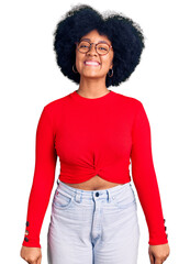 Young african american girl wearing casual clothes and glasses with a happy and cool smile on face. lucky person.