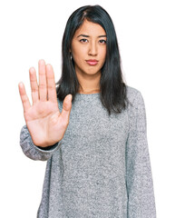 Beautiful asian young woman wearing casual clothes doing stop sing with palm of the hand. warning...