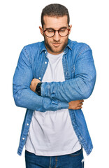 Young caucasian man wearing casual clothes shaking and freezing for winter cold with sad and shock...