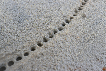 White sand with a pattern formed by rain drops