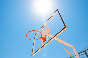 Broken backboard of basketball court in the park. Vandalism concept