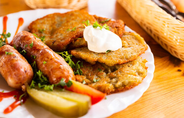 belarusian pancakes with sausages in a restaurant