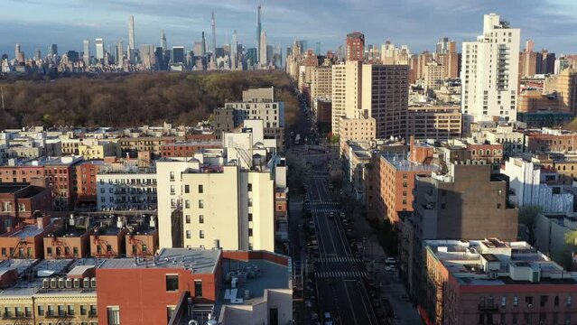 Energetic aerial rise from Harlem NYC towards Centra Park and the Upper West Side just after sunrise