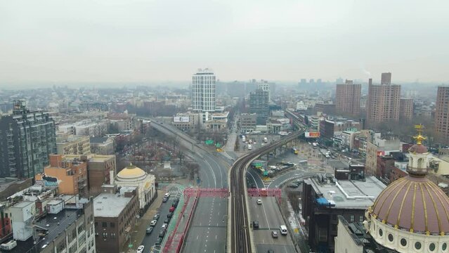 Slow motion drone flyover shot of Brooklyn skyline from Williamsburg Bridge