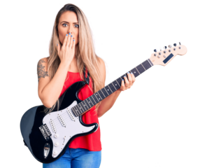 Young beautiful blonde woman playing electric guitar covering mouth with hand, shocked and afraid for mistake. surprised expression
