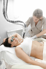 Painless underarm waxing. Hair removal by laser. Waxing process master and client