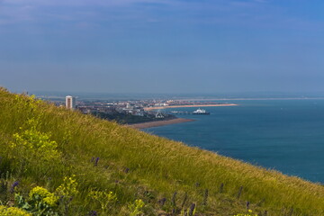 Fototapeta premium Image of Eastbourne, ferris wheel and pier, taken from Beachy Head cliffs, near RAF memorial.