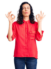 Young beautiful hispanic woman wearing casual clothes relax and smiling with eyes closed doing meditation gesture with fingers. yoga concept.