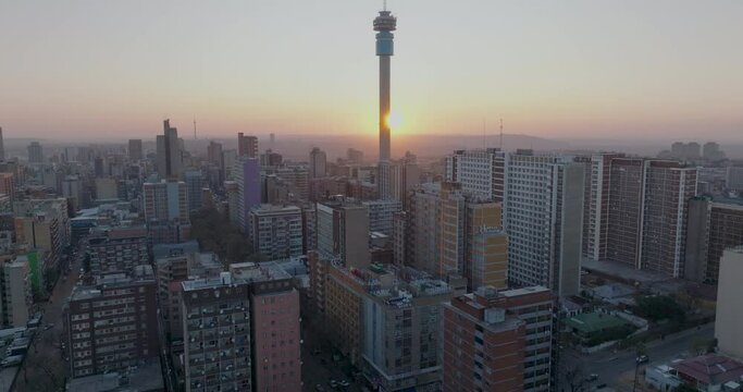 Aerial view of the magnificent Johannesburg City Centre at sunset surrounded by smog and pollution