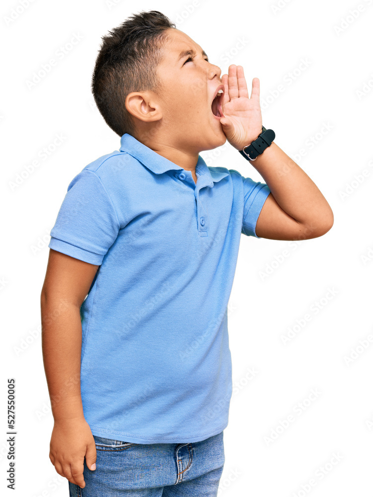 Poster little boy hispanic kid wearing casual clothes shouting and screaming loud to side with hand on mout