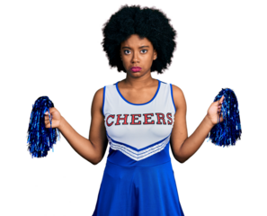 Young african american woman wearing cheerleader uniform using pompom depressed and worry for distress, crying angry and afraid. sad expression.