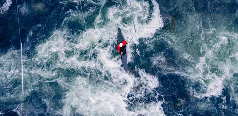Foto op Canvas Top view boat of kayaker on mountain rough blue river, extreme sport kayak, aerial drone photo © Parilov
