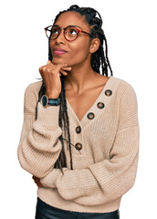 African american woman wearing casual clothes with hand on chin thinking about question, pensive...