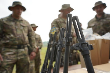 Poltava-Kharkiv region, Ukraine - August 2022: Issuance of American firearms to soldiers of the Ukrainian army and volunteers of the territorial defense. Rifle M14. Lots of firearms.
