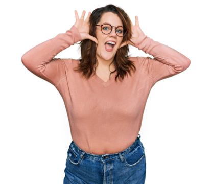 Young plus size woman wearing casual clothes and glasses smiling cheerful playing peek a boo with hands showing face. surprised and exited - Powered by Adobe