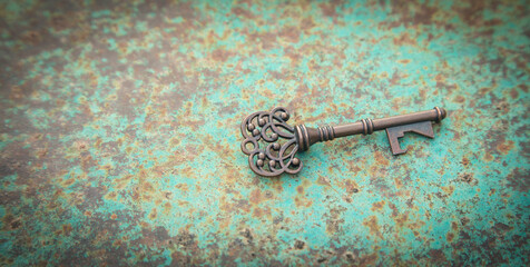 Old key on the old metal background.