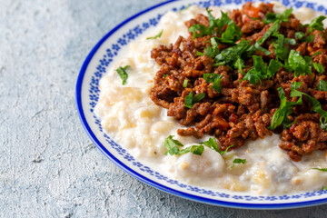 Turkish Ali Nazik Kebab with Yogurt, Minced Meat and Roasted Eggplant or Aubergine Kebap.
