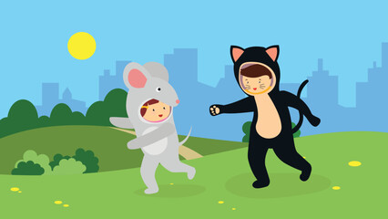 A boy dressed as a cat chases a boy dressed as a mouse