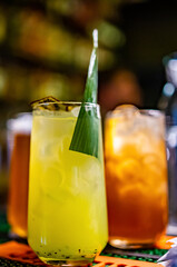 kiwi cocktail in glass at the bar counter.