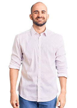 Young handsome man wearing elegant shirt with a happy and cool smile on face. lucky person.