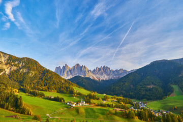 Obraz premium Famous best alpine place of the world, Santa Maddalena village with magical Dolomites mountains in background, Val di Funes valley