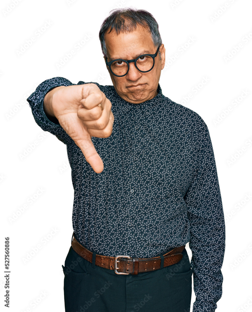 Poster middle age indian man wearing casual clothes and glasses looking unhappy and angry showing rejection