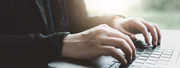 Woman hands typing on computer keyboard closeup, businesswoman or student using laptop panoramic...