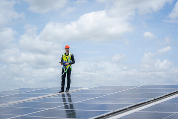 Solar power,Engineer inspect solar panels on the roof of a factory where solar panels are installed...