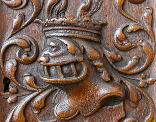 Carved decoration on the wall of a cabinet from the 16th century