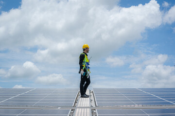 Solar panel energy,Electrical engineer man is working in solar station on roof using...