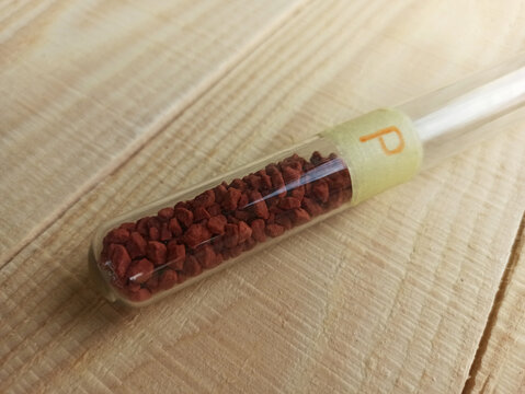 A very important simple inorganic substance - crystalline red phosphorus in a test tube.