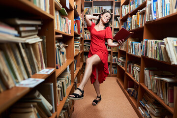 Back to school with attractive librarian in red dress