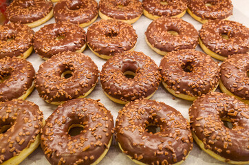 Donuts with chocolate glaze  in bakery shop