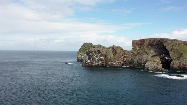 The cliffs and sea stacks An Tor Mor and the Wishing Stone at Port Challa on Tory Island, County Donegal, Ireland
