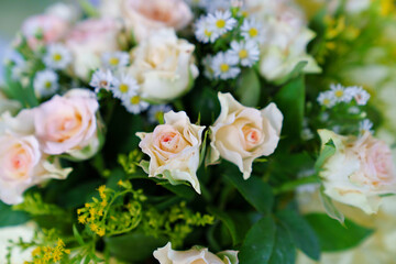 bouquet of pink roses and daisies. delicate and beautiful bouquet.