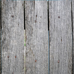 Texture of Old cracked gray boards for background and design. The texture of dry wood planks