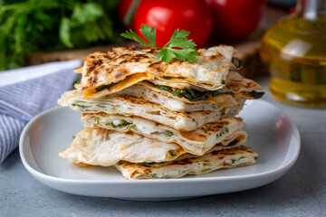 Traditional Turkish food, Turkish pancake gozleme with cheese and herb. The appetizer is Turkish pastry. There are varieties such as cheese, spinach, potato.